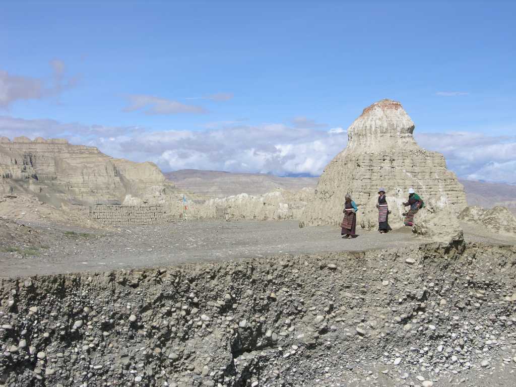 Tibet Guge 04 Tholing 05 108 Chorten Pilgrims I watched pilgrims perform their kora of the Tholing complex, circling these large stupas, which are literally falling down the cliff into the Sutlej river.